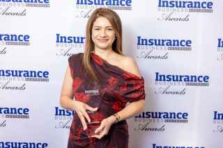 Alana Dennis accepting award for insurer of the year