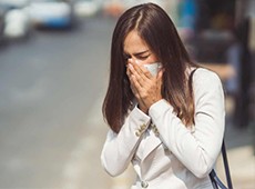 A girl coughing carefully