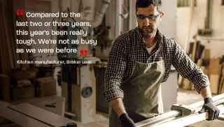 A person working in factory wearing gloves &amp; goggle