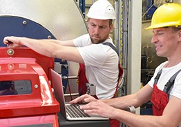 Workers working for machinery.