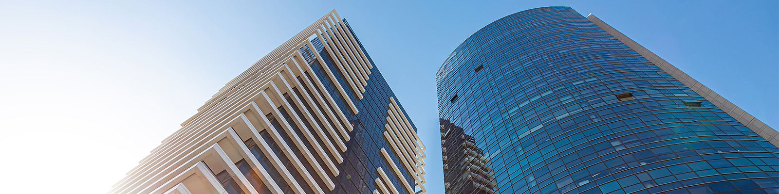 Floor to sky view of two buildings